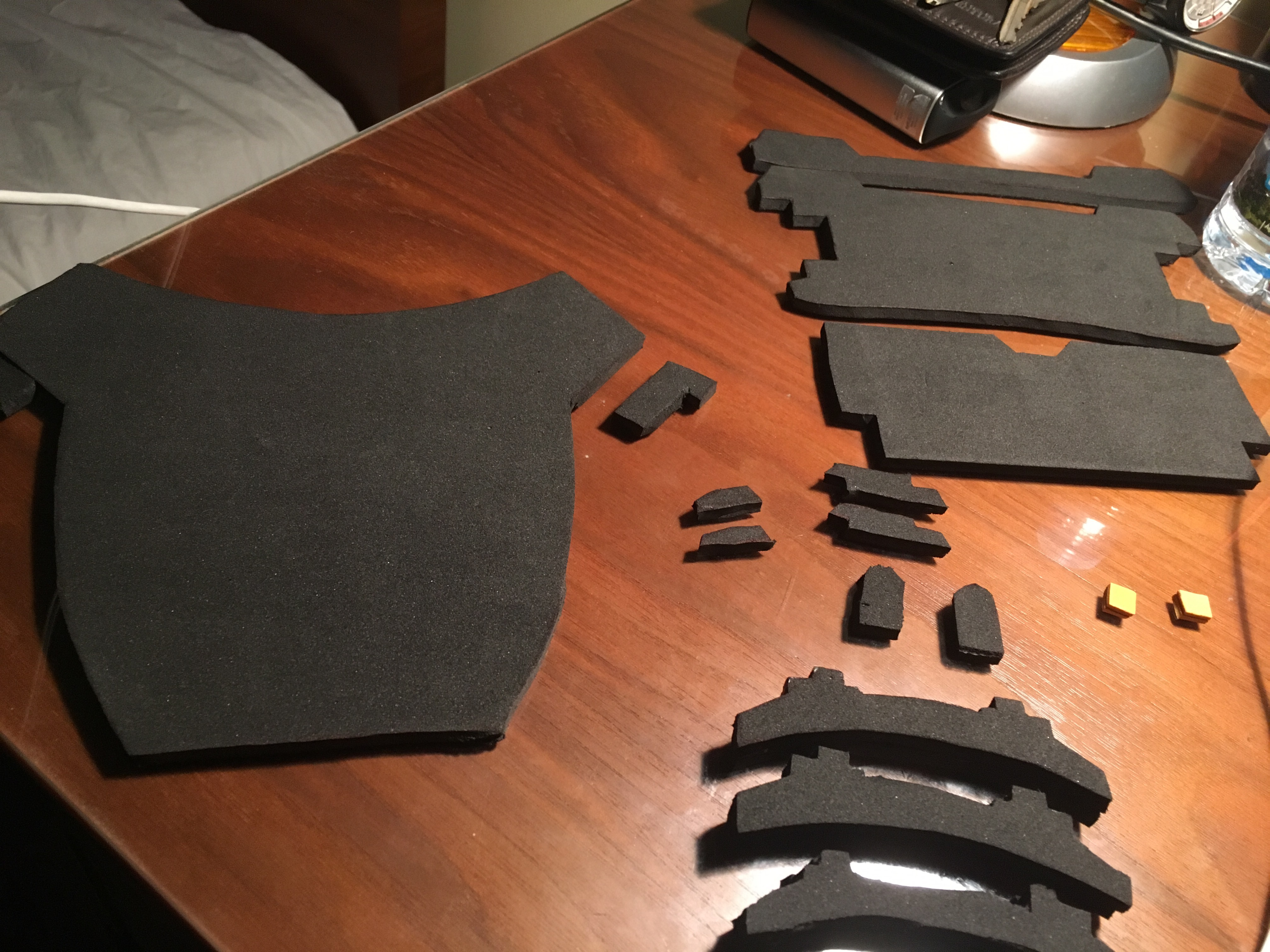 Pieces of the chest visor, cut out of foam